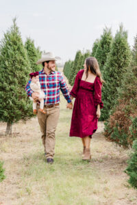 Family enjoying Christmas tree farm mini session near Houston at Dewberry Farm