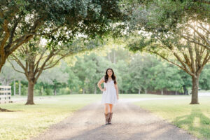 Country-inspired senior photos in Houston farm setting.